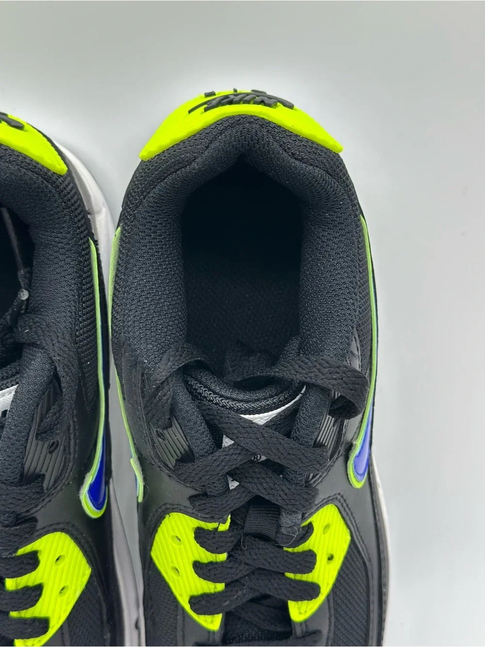 Nike Kids Black Sneakers with Neon Yellow and Blue Swoosh
